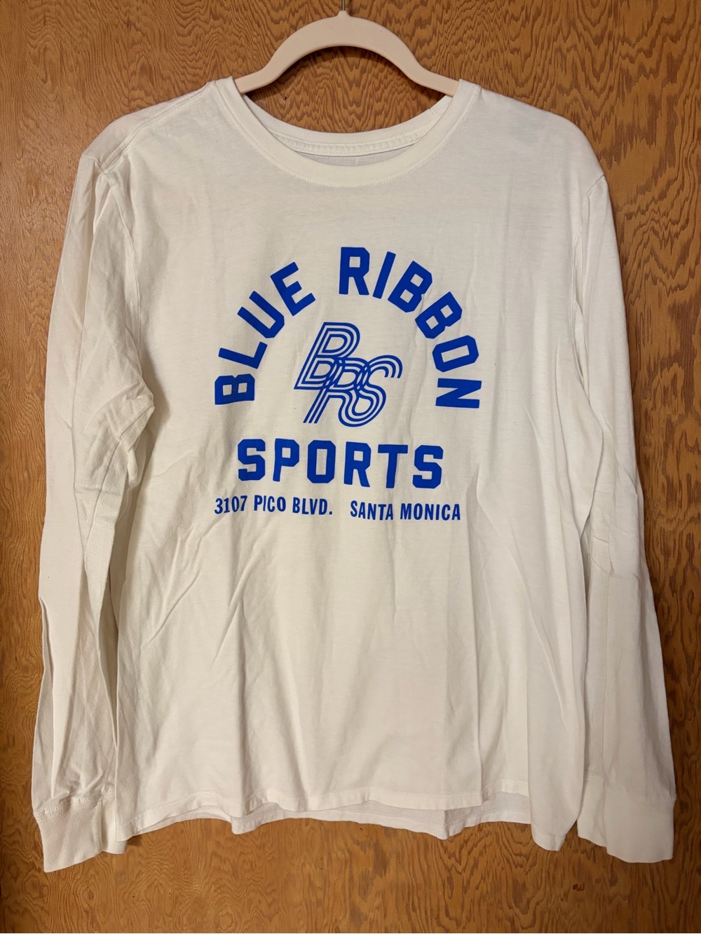 Nike White Long Sleeve Tee with Blue 'Blue Ribbon Sports' Graphic
